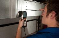 Person Checking Air Flow in a Heat Vent