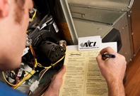 NCI Technician Filling Out Checklist